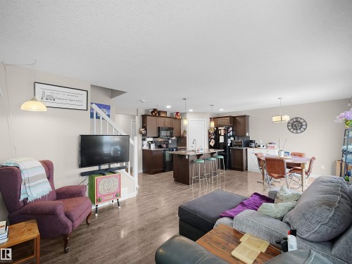 Living room with wood finished floors - 1659 Hammond Crescent, Edmonton, AB - Indoor Photo Showing Living Room