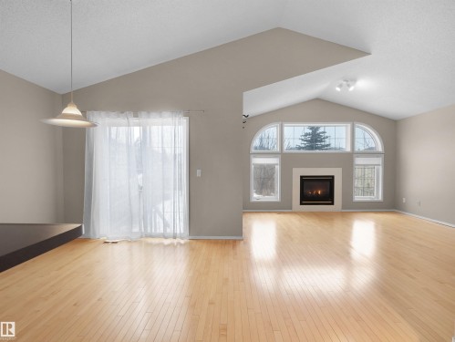 3576 Mclean Crescent, Edmonton, AB - Indoor Photo Showing Living Room With Fireplace