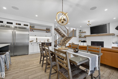 4470 Suzanna Crescent, Edmonton, AB - Indoor Photo Showing Dining Room With Fireplace