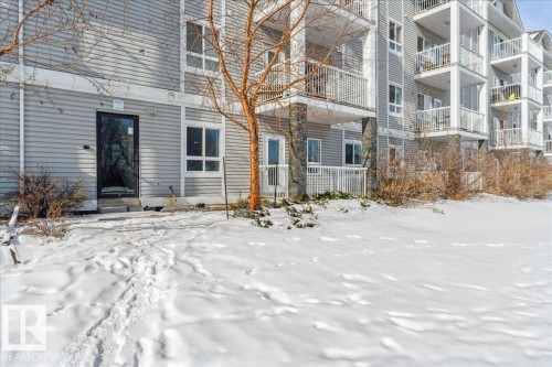 View of snow covered property entrance - 112 5340 199 Street, Edmonton, AB - Outdoor With Facade