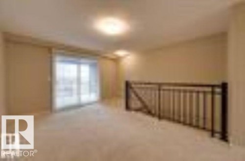 View of additional living space - 1649 Cunningham Way, Edmonton, AB - Indoor Photo Showing Other Room