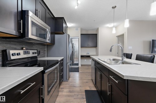 214 1004 Rosenthal Boulevard, Edmonton, AB - Indoor Photo Showing Kitchen With Double Sink With Upgraded Kitchen