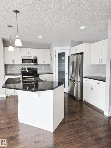 475 Reed Crescent, Leduc, AB - Indoor Photo Showing Kitchen With Stainless Steel Kitchen With Double Sink