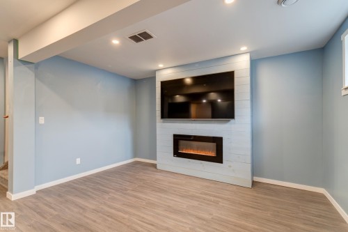 475 Reed Crescent, Leduc, AB - Indoor Photo Showing Living Room With Fireplace