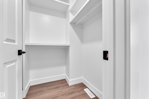 Walk in closet with light wood-style floors - 6741 162A Avenue, Edmonton, AB - Indoor
