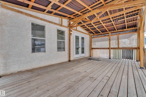 Wooden terrace featuring french doors - 6741 162A Avenue, Edmonton, AB -  Photo Showing Other Room