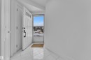Foyer entrance featuring light marble finish flooring - 6741 162A Avenue, Edmonton, AB  - Indoor Photo Showing Other Room 