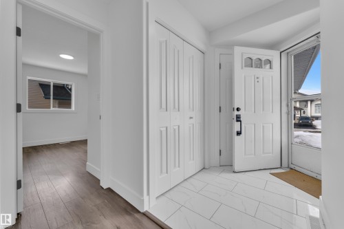 Foyer with baseboards and light wood-style floors - 6741 162A Avenue, Edmonton, AB - Indoor Photo Showing Other Room