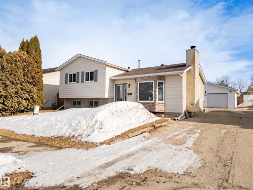 Split level home featuring a chimney and a garage - 9221 84 Street, Fort Saskatchewan, AB - Outdoor