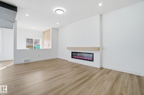 7603 92 Avenue, Edmonton, AB - Indoor Photo Showing Other Room With Fireplace