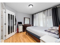 Bedroom with light wood finished floors - 