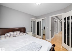 Bedroom featuring a closet and light wood-style floors - 