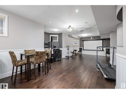 Exercise area with wainscoting and recessed lighting - 