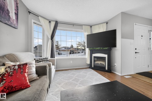 207 River Point(E), Edmonton, AB - Indoor Photo Showing Living Room With Fireplace