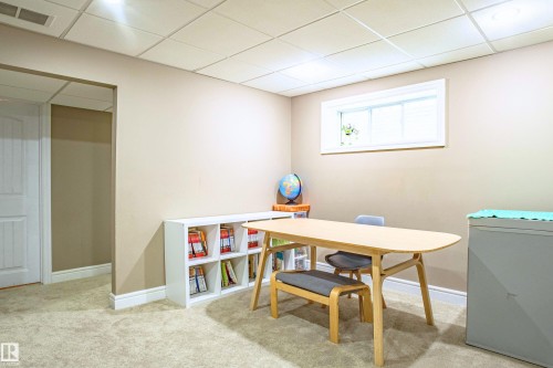 Office featuring a paneled ceiling and light carpet - 2224 Austin Way, Edmonton, AB - Indoor