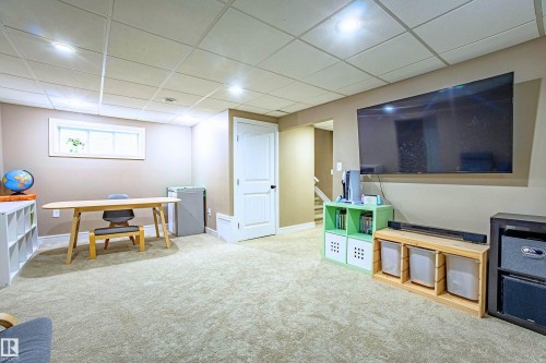 Office space featuring a drop ceiling and light carpet - 2224 Austin Way, Edmonton, AB - Indoor