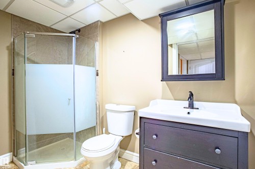 Bathroom with vanity, a shower stall, and a drop ceiling - 2224 Austin Way, Edmonton, AB - Indoor Photo Showing Bathroom
