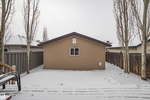 Snow covered property featuring a fenced backyard - 2224 Austin Way, Edmonton, AB - Outdoor With Exterior