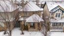 View of front facade with covered porch, a residential view, and a shingled roof - 2224 Austin Way, Edmonton, AB  - Outdoor With Deck Patio Veranda 