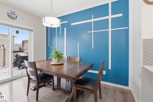 Dining area featuring wood finished floors and baseboards - 5112 Andison Close, Edmonton, AB - Indoor Photo Showing Dining Room
