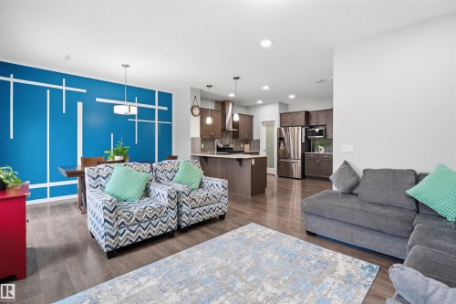 Living room with dark wood-style flooring and recessed lighting - 5112 Andison Close, Edmonton, AB - Indoor Photo Showing Living Room