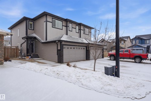 View of front of house with an attached garage - 5112 Andison Close, Edmonton, AB - Outdoor