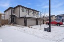 View of front of house with an attached garage - 5112 Andison Close, Edmonton, AB  - Outdoor 