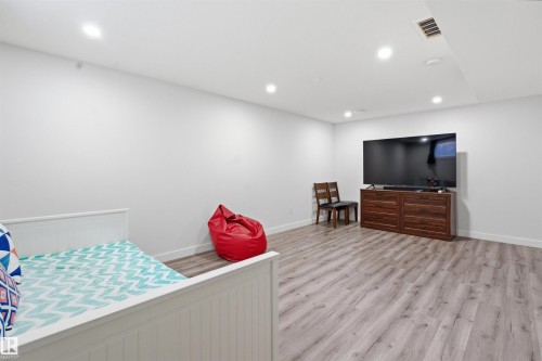 Bedroom featuring light wood finished floors and recessed lighting - 5112 Andison Close, Edmonton, AB - Indoor