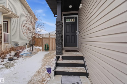 Entrance to property with stone siding - 5112 Andison Close, Edmonton, AB - Outdoor