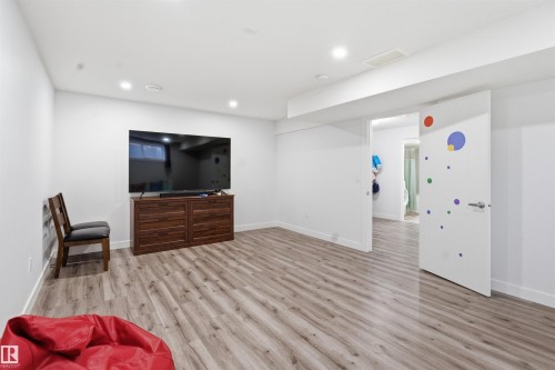Living area with light wood-type flooring and recessed lighting - 5112 Andison Close, Edmonton, AB - Indoor