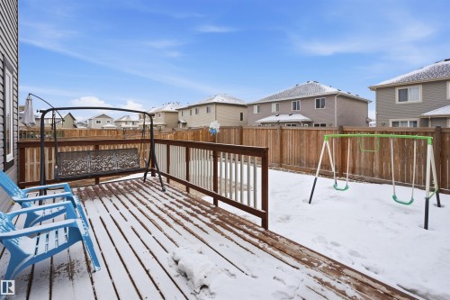 Wooden deck with a residential view and a fenced backyard - 5112 Andison Close, Edmonton, AB - Outdoor With Deck Patio Veranda With Exterior