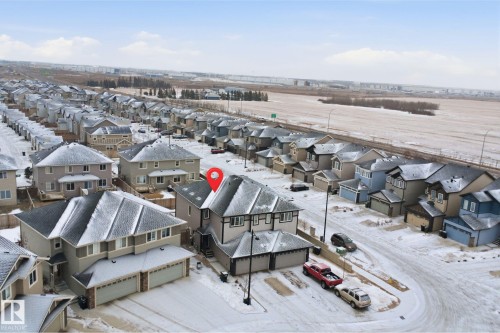 Snowy aerial view featuring a residential view - 5112 Andison Close, Edmonton, AB - Outdoor With View