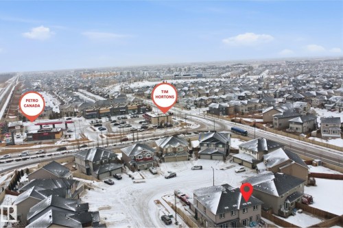 Snowy aerial view featuring a residential view - 5112 Andison Close, Edmonton, AB - Outdoor With View