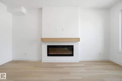 7605 92 Avenue, Edmonton, AB - Indoor Photo Showing Living Room With Fireplace