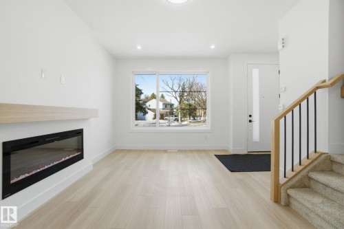 7605 92 Avenue, Edmonton, AB - Indoor Photo Showing Living Room With Fireplace