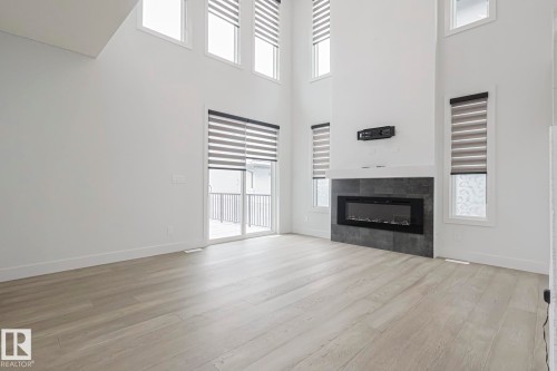 7446 Colonel Mewburn Road, Edmonton, AB - Indoor Photo Showing Living Room With Fireplace