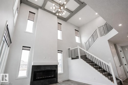 7446 Colonel Mewburn Road, Edmonton, AB - Indoor Photo Showing Other Room With Fireplace