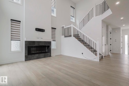 7446 Colonel Mewburn Road, Edmonton, AB - Indoor Photo Showing Other Room With Fireplace