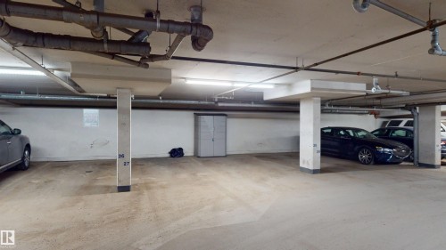 Garage with a parking garage - 115 9938 104 St, Edmonton, AB - Indoor Photo Showing Garage