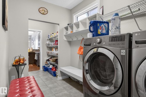 Laundry room with light tile patterned floors - 21867 80 Avenue, Edmonton, AB - Indoor Photo Showing Laundry Room