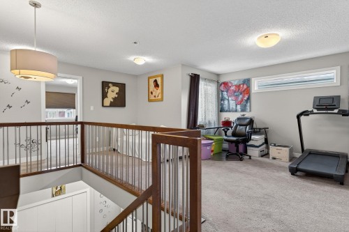 Hall featuring carpet flooring and a textured ceiling - 21867 80 Avenue, Edmonton, AB - Indoor Photo Showing Other Room