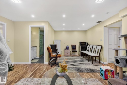 Office space with light wood finished floors and recessed lighting - 21867 80 Avenue, Edmonton, AB - Indoor