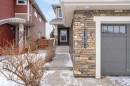 Snow covered property entrance featuring stone siding - 21867 80 Avenue, Edmonton, AB  - Outdoor 