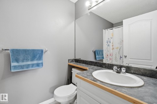 Full bathroom with vanity and a shower with shower curtain - 421 155 Edwards Drive, Edmonton, AB - Indoor Photo Showing Bathroom