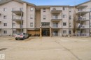 View of apartment building / complex featuring uncovered parking - 421 155 Edwards Drive, Edmonton, AB  - Outdoor With Facade 