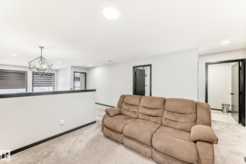 Living room featuring recessed lighting and light carpet - 5110 23A Avenue, Edmonton, AB - Indoor Photo Showing Living Room