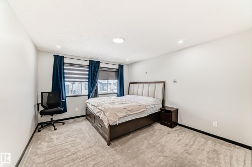 Bedroom with light carpet and recessed lighting - 5110 23A Avenue, Edmonton, AB - Indoor Photo Showing Bedroom