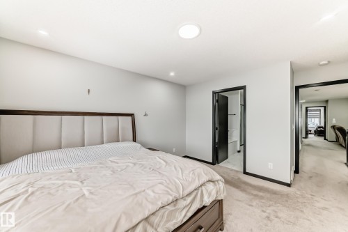 Bedroom featuring light colored carpet and recessed lighting - 5110 23A Avenue, Edmonton, AB - Indoor Photo Showing Bedroom