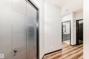 Hall with light wood-style floors and baseboards - 5110 23A Avenue, Edmonton, AB  - Indoor Photo Showing Other Room 
