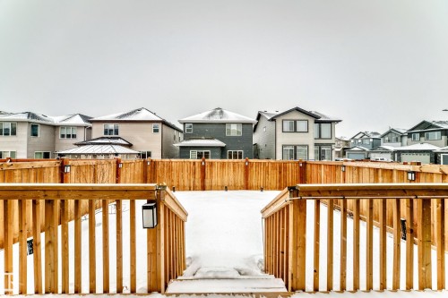 Deck featuring a residential view and a fenced backyard - 5110 23A Avenue, Edmonton, AB - Outdoor With Deck Patio Veranda
